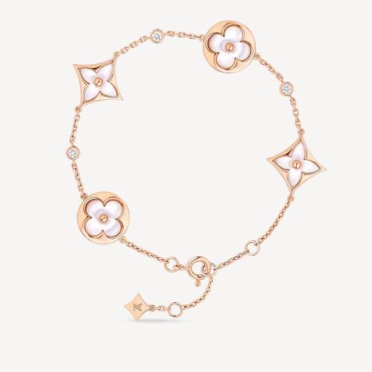 [BIJOUX]BRACELET ETOILE ET SOLEIL 4 MOTIFS NACRE BLANCHE OR ROSE